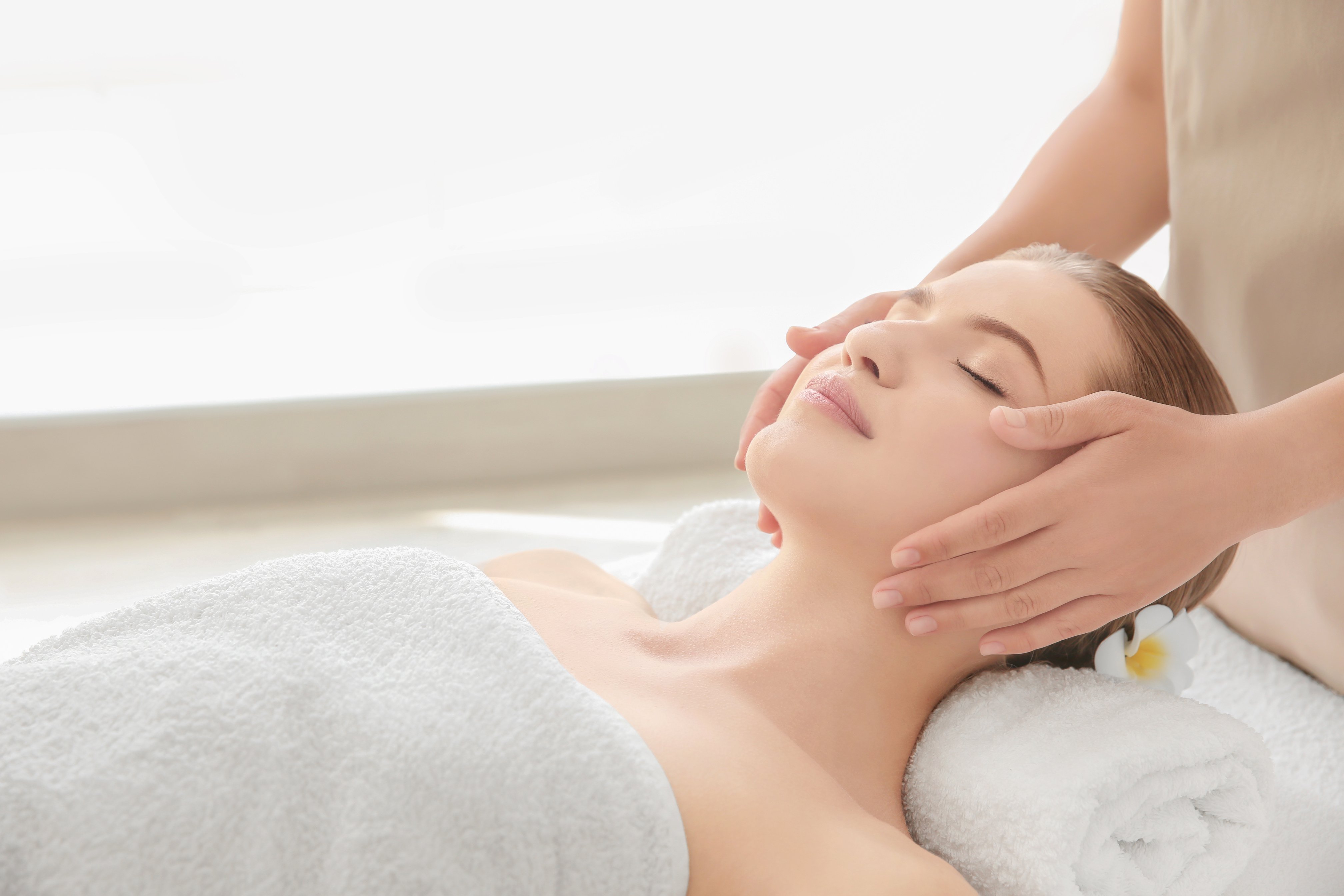 Woman Enjoying  Facial Massage
